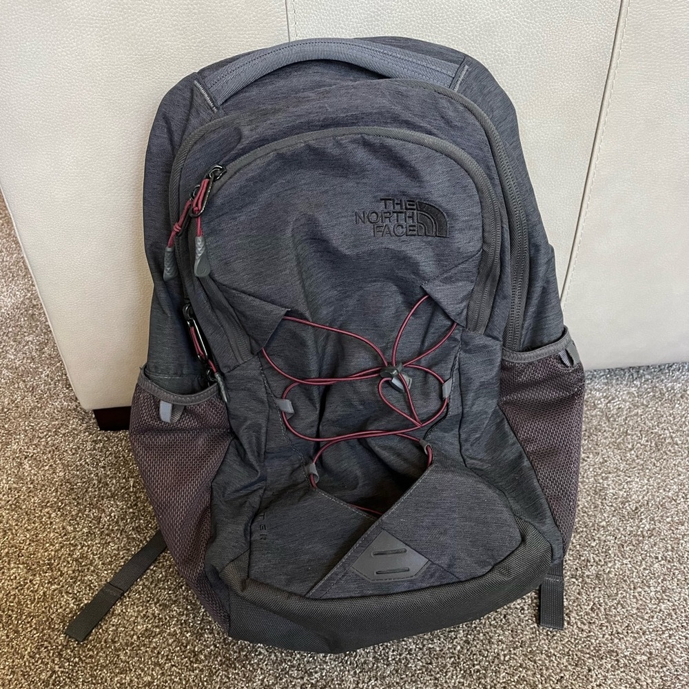 Grey North Face Backpack with Maroon Accents
